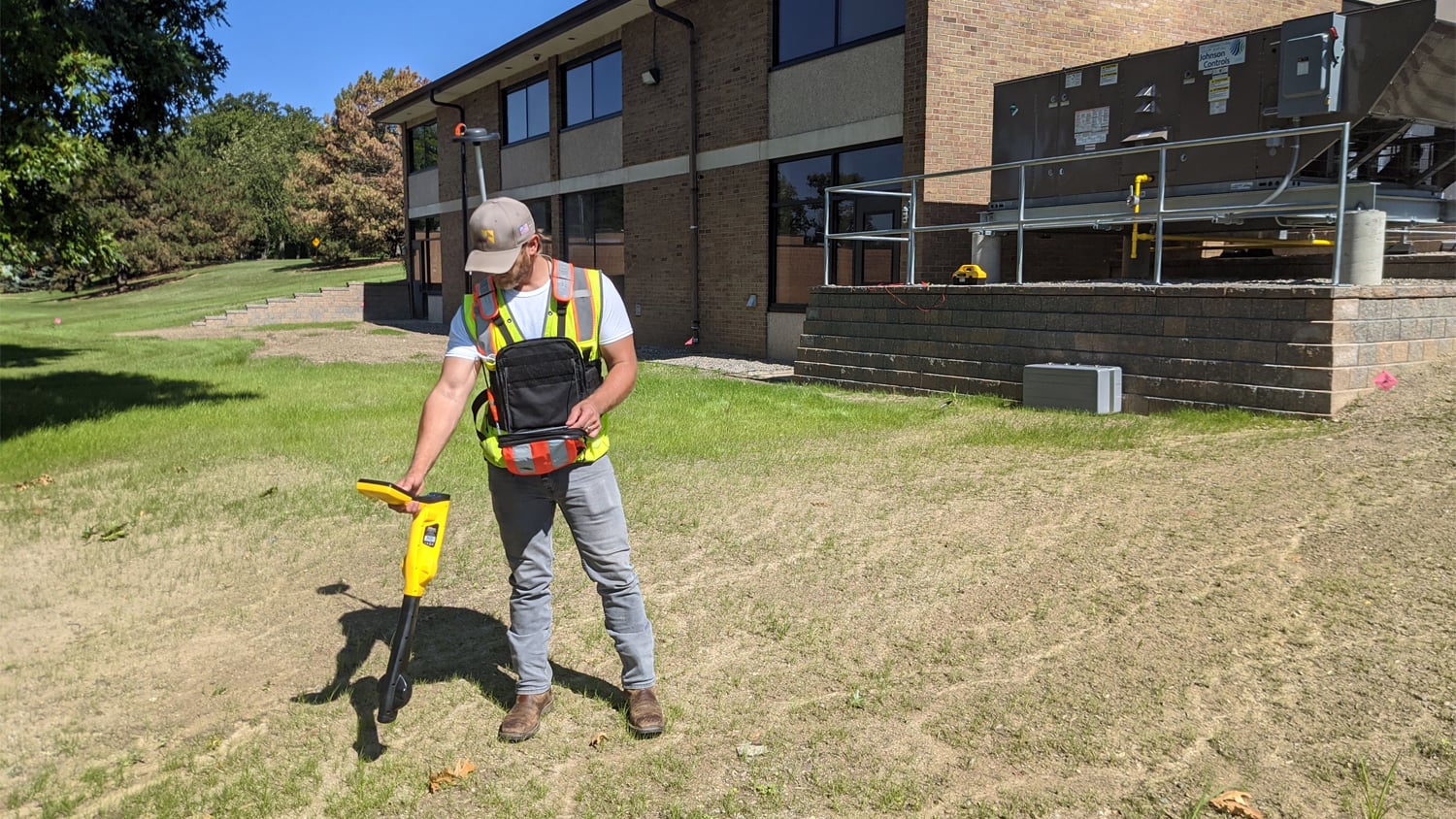 Field technician mapping buried infrastructure with Eos Locate for ArcGIS and an Arrow Gold GNSS receiver
