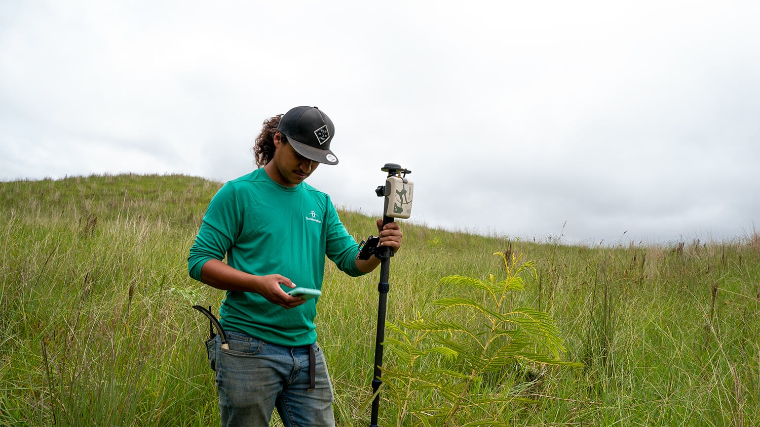 Environmental scientist mapping habitat features with an Eos Arrow GNSS receiver
