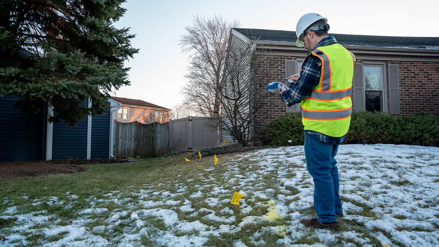 Gas utility technician collecting distribution asset data with a Skadi Gold GNSS receiver