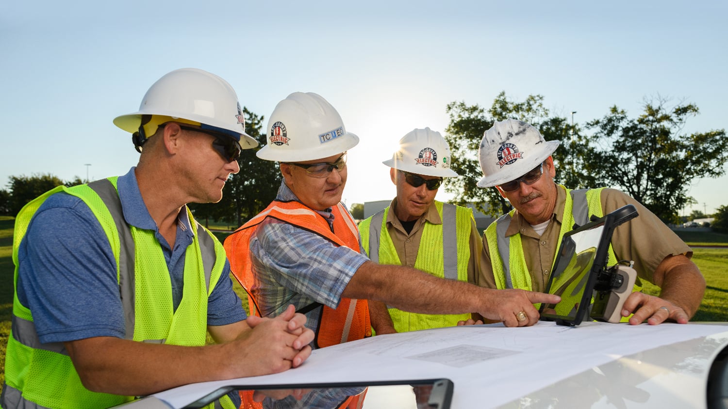 Electric cooperative employee staking utility poles with an Eos Arrow GNSS receiver
